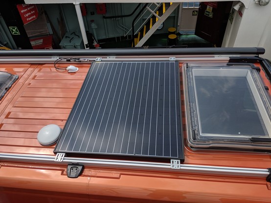 200W solar panel on the roof of the van.