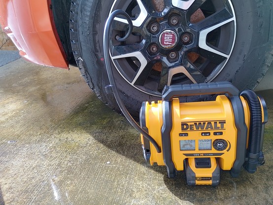 A DeWalt battery/12V plug inflator. Noisy and slow but does the job.