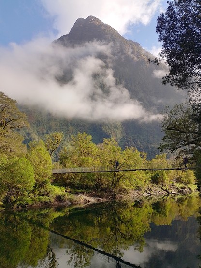 A still river crossing in the early morning.