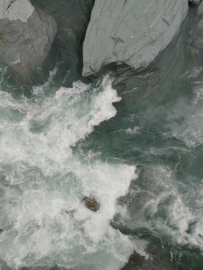 View from one of the swing bridges. Huge boulders and glacier-fed water.