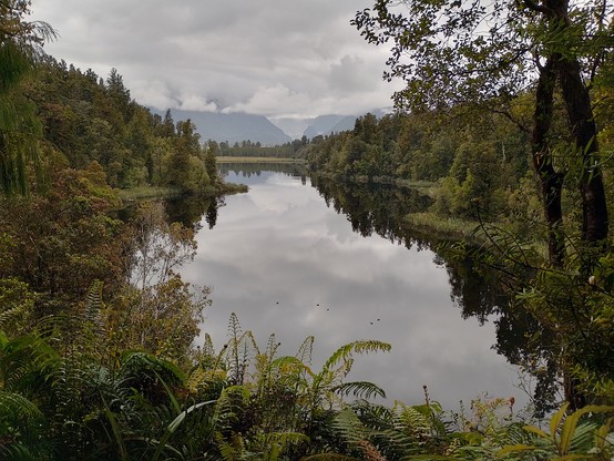 Mirror views at Lake Matheson. Behind the cloud is Mt Cook.