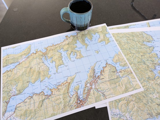 Printed topo maps of the Marlborough Sounds and Tasman area.